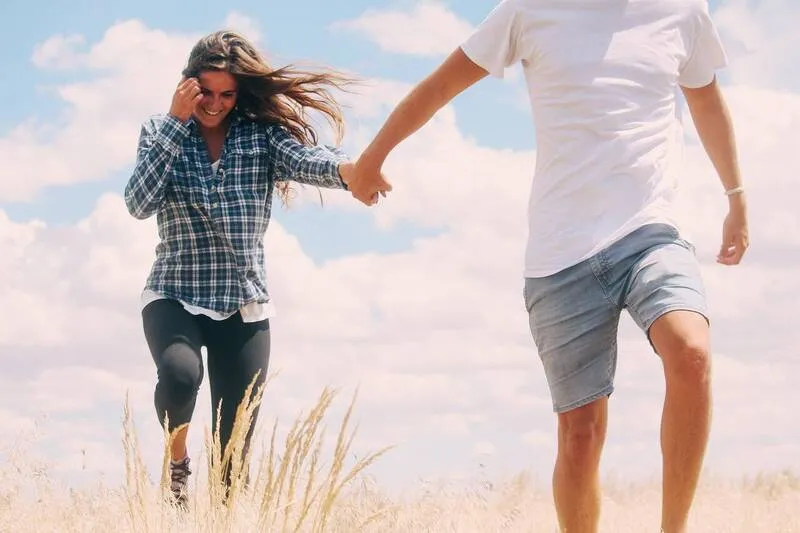 Couple smiling while reviewing their retirement plan